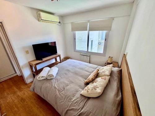 Een bed of bedden in een kamer bij C2 Apart Salta