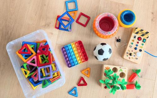a group of toys on a wooden floor at Ferienwohnung BergOase mit Pool & Sauna in Scheidegg