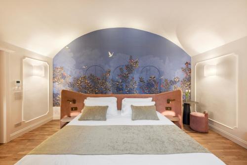 Giường trong phòng chung tại Palazzo Dogali Suites Collection
