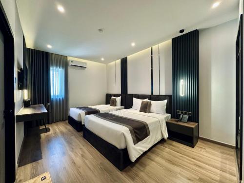 Postel nebo postele na pokoji v ubytování LION 15 Hotel