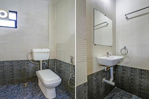 a bathroom with a toilet and a sink at Super Collection O Besa Square Nagpur Formerly Yuva Inn in Nagpur