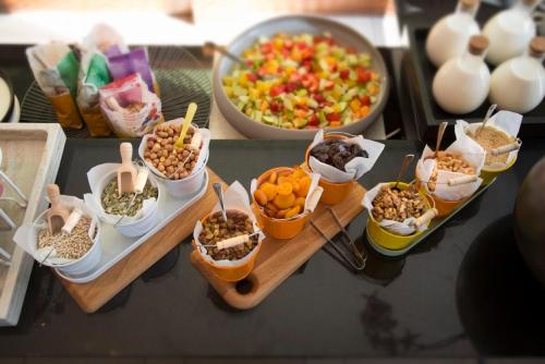 a group of bowls of food on a table at Radisson Blu Hotel Karlsruhe in Ettlingen