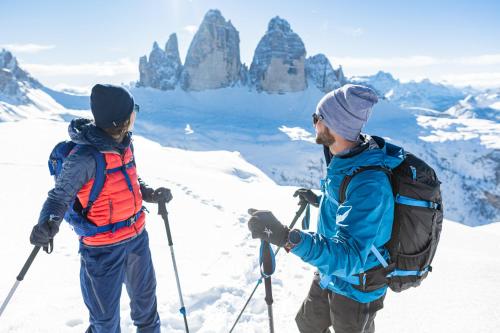 two people standing on top of a snow covered mountain at Montanaris Alpine - Active - Relax in Villabassa