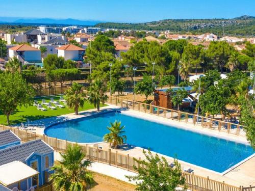 Πισίνα στο ή κοντά στο Mobil-home 3 ch camping TOHAPI
