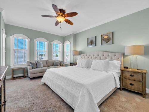 a bedroom with a bed and a ceiling fan at Penthouse Paradise Condo at Seacrest in Rosemary Beach