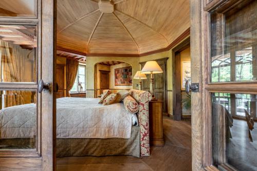 a bedroom with a large bed in a room at LeSable luxury vacation home in Kluisbergen