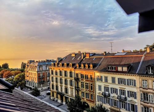 a view of a building in a city at Hôtel Des Arts in Neuchâtel