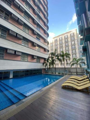 a swimming pool in the middle of a building at 101 Newport Boulevard Condo in Manila