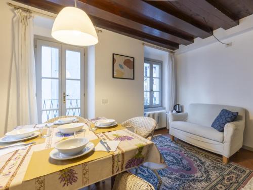 a living room with a table and a couch at Apartment Vicolo Ninguarda by Interhome in Morbegno