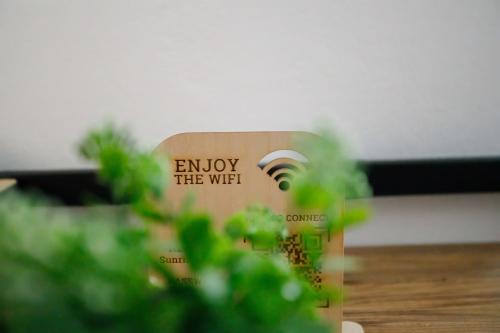 a book with the words enjoy the wifi at Sunrise Apartment in Heraklio Town