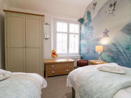 a bedroom with two beds and a window at The Hideout in Oakham