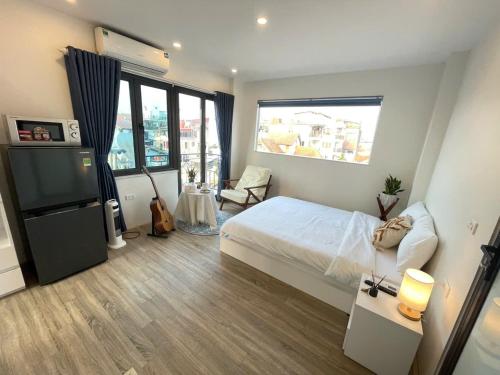 Ein Bett oder Betten in einem Zimmer der Unterkunft CHARM CHARM - kimmy housing - 48 To Ngoc Van