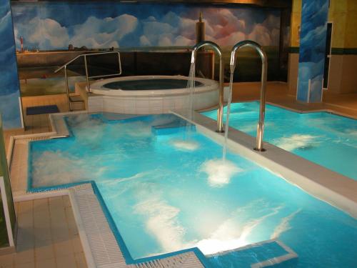 a jacuzzi tub in a room with at Silken Spa La Hacienda De Don Juan in Llanes