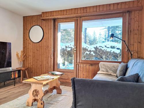 a living room with a couch and a table at Apartment Arolla R01 by Interhome in Champex