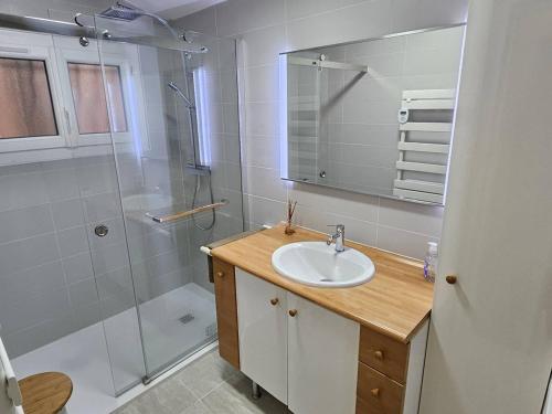 a bathroom with a sink and a shower at Villa provençale avec piscine privée, clim, Wi-Fi, jardin, 5 chambres - FR-1-768-20 in Les Issambres