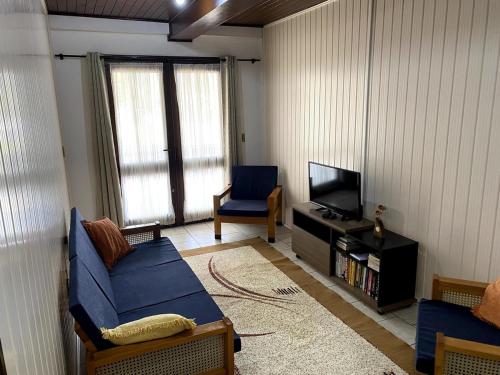 Televisyen dan/atau pusat hiburan di Apartamento espaçoso e central