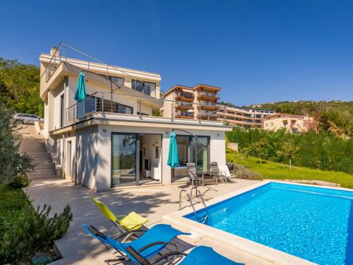 a villa with a swimming pool and a house at Villa Anna by Interhome in Opatija