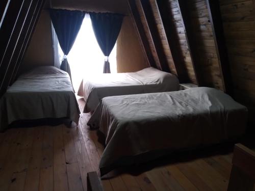 En eller flere senge i et værelse på Complejo Habitacional RLM 25