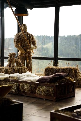 a man standing in a room with hay at Premium Club SPA in Bukovel