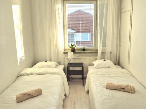 Postel nebo postele na pokoji v ubytování M&J Apartments Centrum