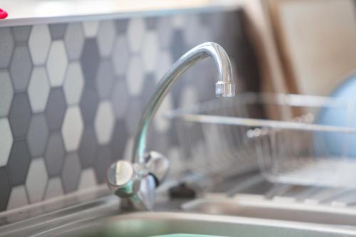 a kitchen sink with a faucet and a sink at Cnapan Guest House in Newport Pembrokeshire