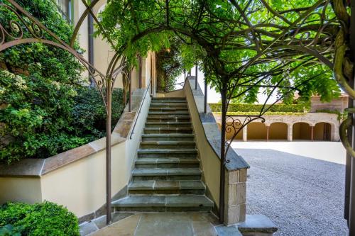 a staircase leading up to a building with trees at LeSable luxury vacation home in Kluisbergen