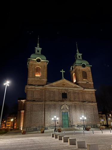an old church with a cross on top of it at Sveriges minsta Hotell! Hôtel Gruyère in Landskrona