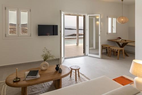 a living room with a couch and a table at GN7 Villas in Kithnos