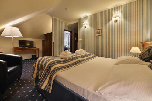 Postel nebo postele na pokoji v ubytování Hotel Morris Relax & Wellness