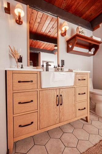 a bathroom with a sink and a mirror at Lodge At Marconi in Marshall