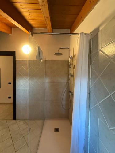 a bathroom with a shower with a glass door at Affittacamere Karma Rho-Fiera in Rho