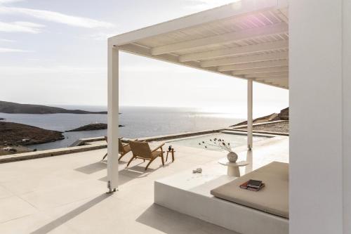 a white house with a view of the ocean at GN7 Villas in Kithnos