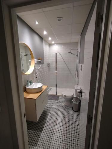a bathroom with a shower and a sink and a toilet at Tuty in Málaga