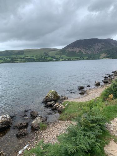 a large body of water with mountains in the background at Rose Cottage in Wigton