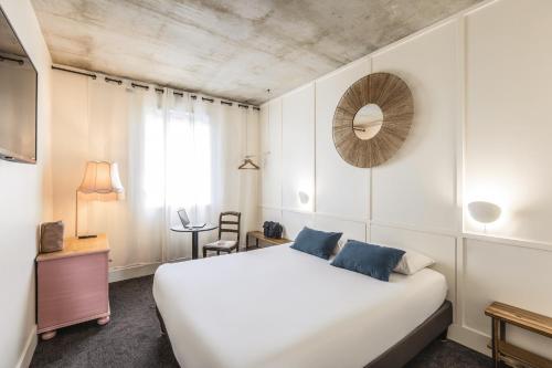 Postel nebo postele na pokoji v ubytování Greet Hotel Limoges Nord