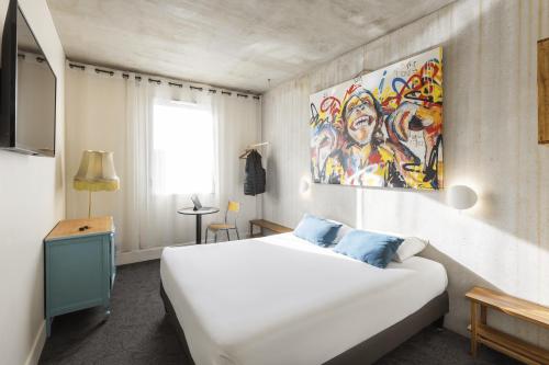 Postel nebo postele na pokoji v ubytování Greet Hotel Limoges Nord