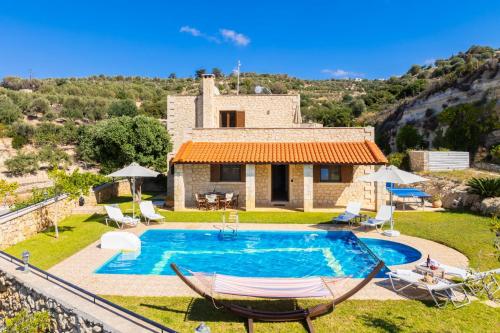 an image of a villa with a swimming pool at Villa Hara Faragi in Giannoudi