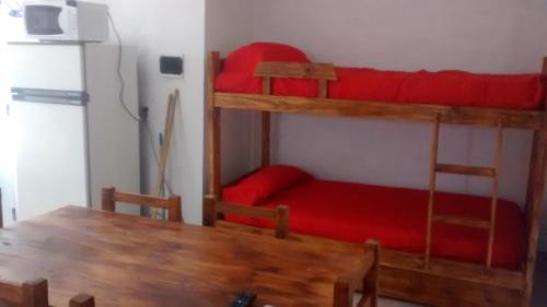 Μία ή περισσότερες κουκέτες σε δωμάτιο στο Casita de Arena Cabañas