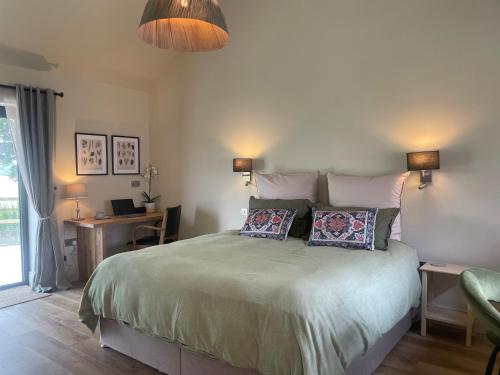 a bedroom with a bed with two pillows on it at Rural Retreat, 1 bed, sleeps 2 near Bleasby in Bleasby