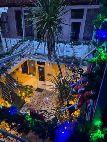 an overhead view of a building with a palm tree at Shapatava ApartHotel in Batumi