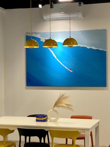 a painting of a person flying a kite at 嘿夏天 HeySummer-13pax l 200mJetty l Netflix l Games l Youtube in Mersing