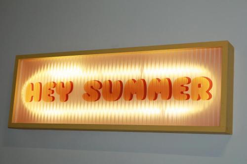a lit up sign for a big summer sign at 嘿夏天 HeySummer-13pax l 200mJetty l Netflix l Games l Youtube in Mersing