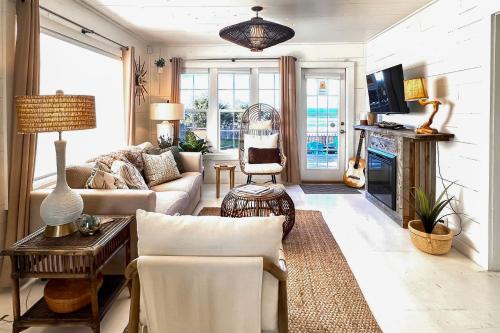 a living room with a couch and a fireplace at Sunset Beach Getaway in Moclips