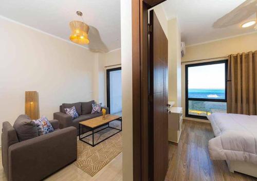 Postel nebo postele na pokoji v ubytování BLUE ViEW SUiTES
