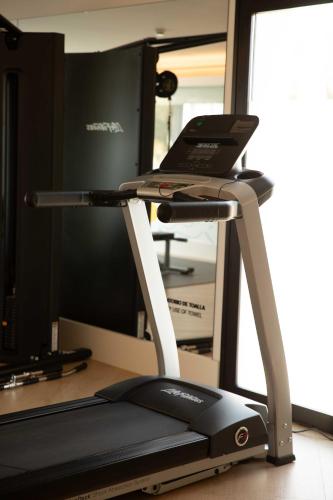 a treadmill with a laptop on top of it at Hotel Almirante in Alicante