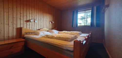 Ένα ή περισσότερα κρεβάτια σε δωμάτιο στο Sauna | Wi-Fi | Terrace | Wood stove | Cable TV