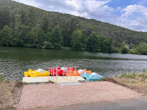 a group of play equipment in the middle of a lake at Le Clos Joli in Haybes