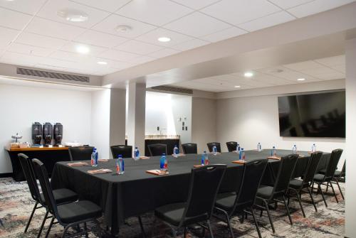 a conference room with a long table and chairs at Holiday Inn St Louis SW - Route 66 by IHG in Saint Louis