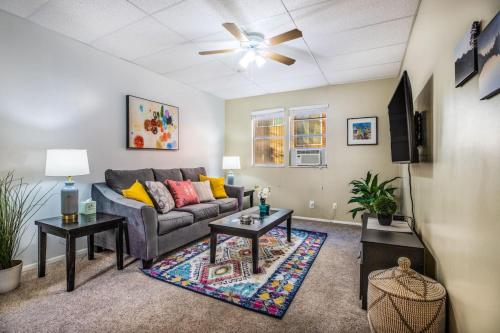 a living room with a couch and two tables at Historic Avenues Apartment Downtown in Salt Lake City