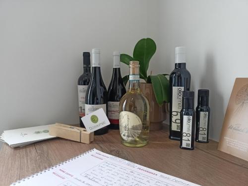 a bunch of bottles of wine sitting on a table at Casa Umeli with Jacuzzi and Sauna in Marsala